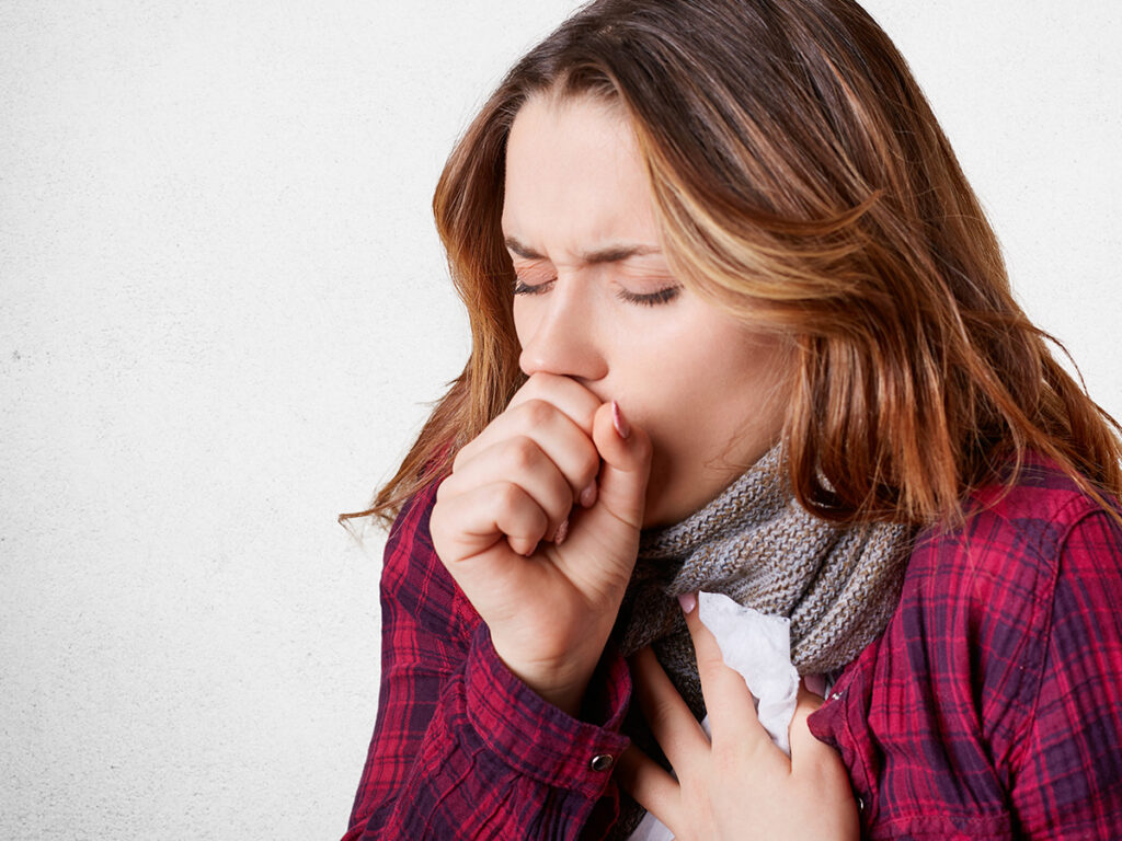 Image of a girl coughing