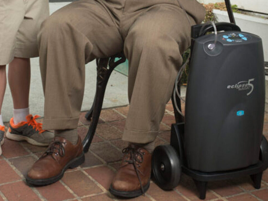 Image of a man with an oxygen tank