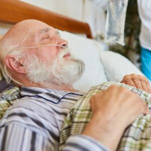 man sleeping with nasal cannula on